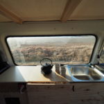 kitchen in a camper van with tea pot